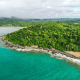 cliffs, a beach, jungle and houses inbetween
