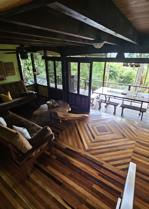 living room and terrace in the jungle, wooden floor